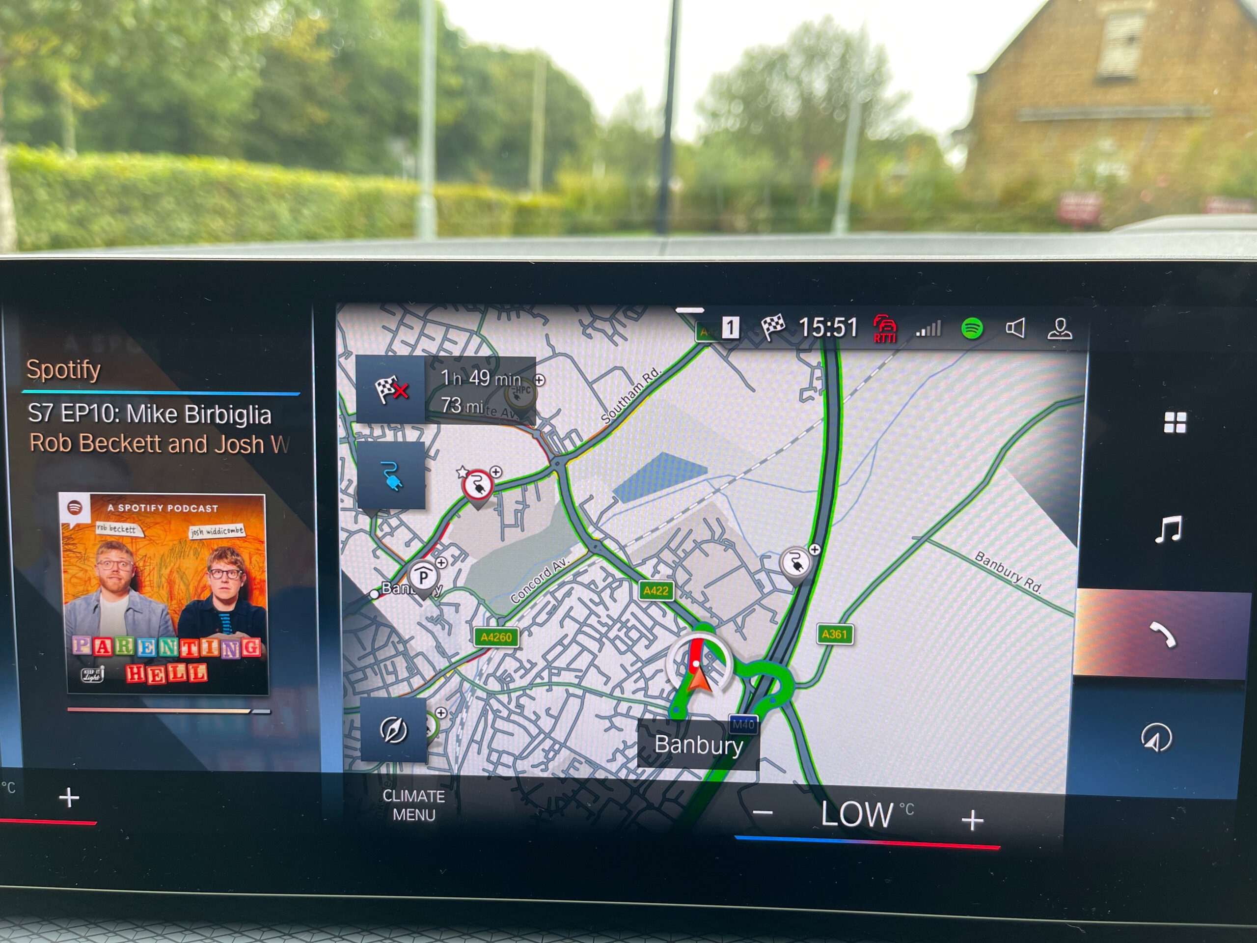 screen showing sat nav and Spotify after last charge of the day