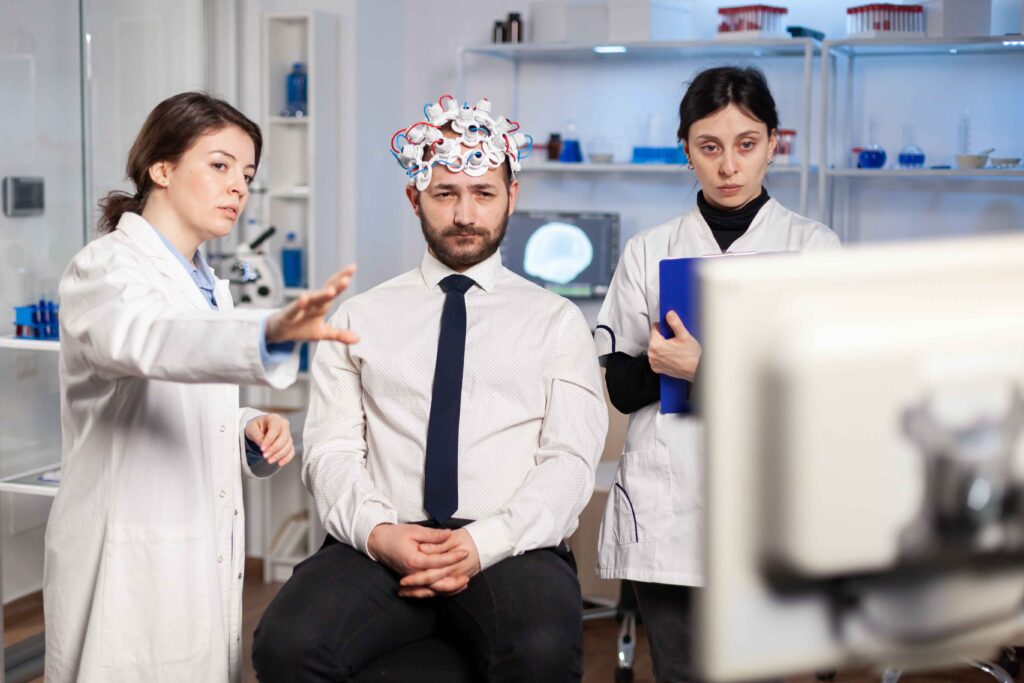 neurological health care professionals discussing results with middle aged man