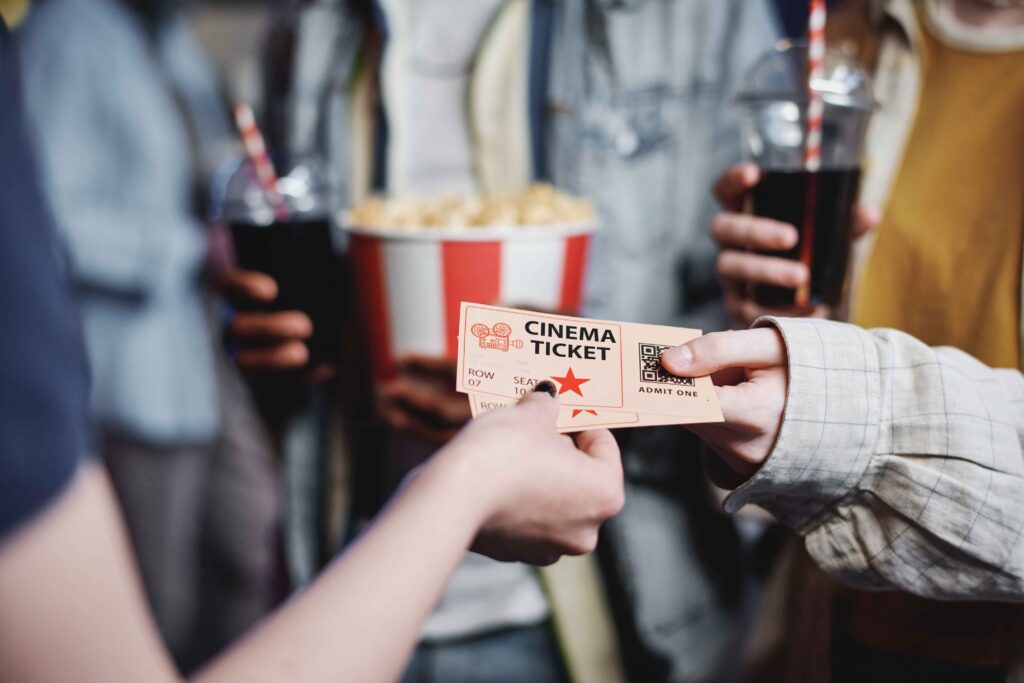 picture of person handing over a cinema ticket