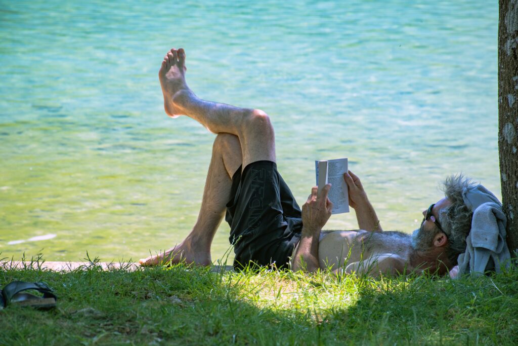 a man reading a book on holiday